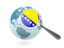 Bosnia and Herzegovina. Magnified flag with blue globe. Download icon.