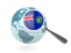 Pitcairn Islands. Magnified flag with blue globe. Download icon.