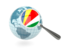 Seychelles. Magnified flag with blue globe. Download icon.