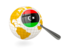 Libya. Magnified flag with globe. Download icon.