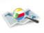 Comoros. Magnified flag with map. Download icon.