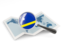 Curacao. Magnified flag with map. Download icon.