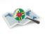Dominica. Magnified flag with map. Download icon.
