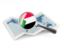 Sudan. Magnified flag with map. Download icon.