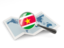 Suriname. Magnified flag with map. Download icon.