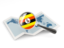 Uganda. Magnified flag with map. Download icon.