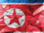 North Korea. Triangle background. Download icon.